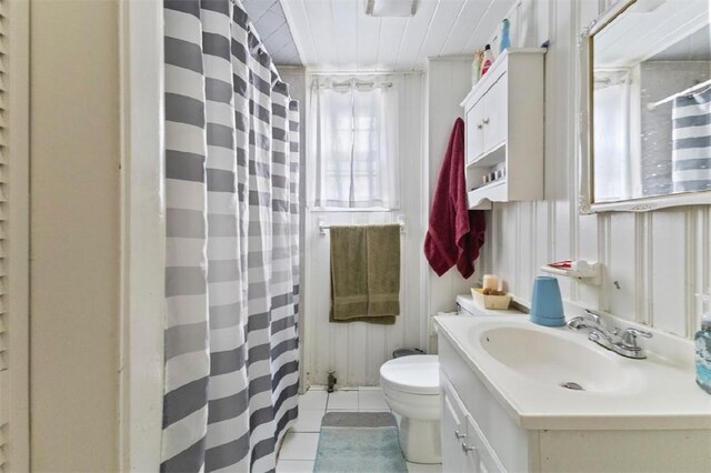 97 Detroit Ave, Providence, RI 02907 - full bathroom featuring vanity, tile patterned flooring, and a shower with shower curtain