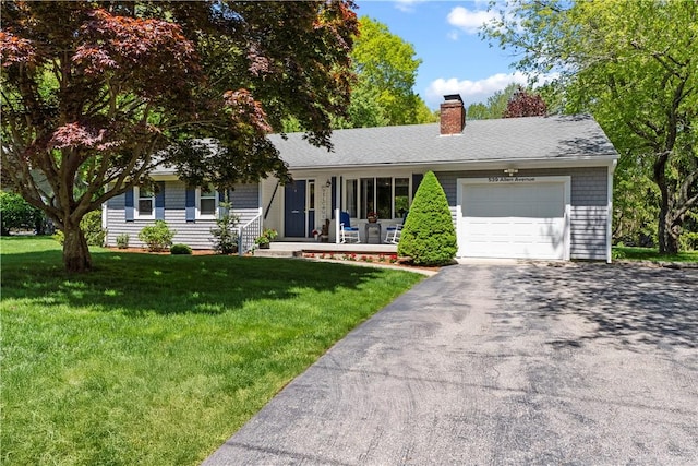 539 Allen Ave, South Kingstown, RI 02879 - view of front of house featuring a porch, a garage, driveway, a front yard, and a chimney