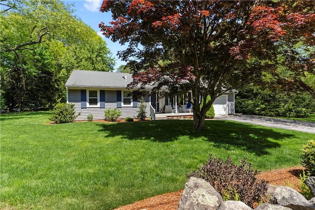 539 Allen Ave, South Kingstown, RI 02879 - view of front of house with a front lawn, a porch, and driveway