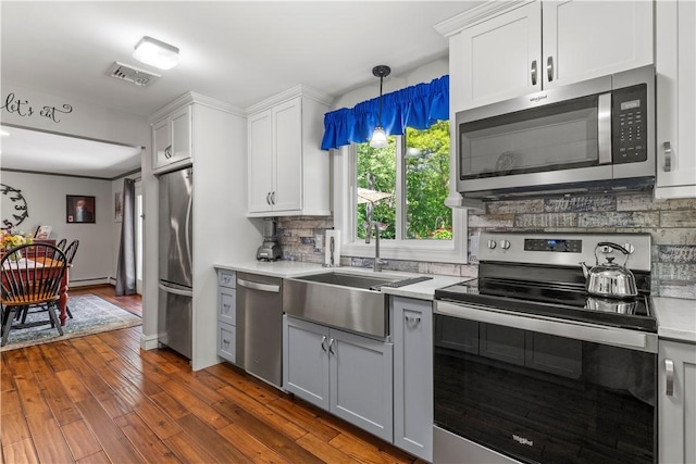 539 Allen Ave, South Kingstown, RI 02879 - kitchen featuring stainless steel appliances, a sink, light countertops, and backsplash