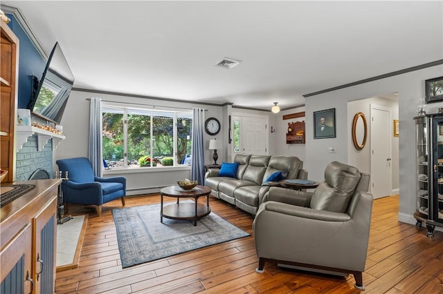 539 Allen Ave, South Kingstown, RI 02879 - living room featuring ornamental molding, hardwood / wood-style flooring, a fireplace, baseboard heating, and baseboards