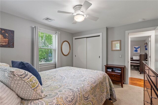 539 Allen Ave, South Kingstown, RI 02879 - bedroom with a closet, light colored carpet, and ceiling fan