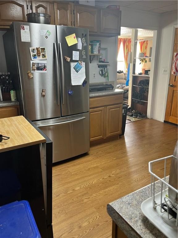 79 Dewey St, Woonsocket, RI 02895 - kitchen featuring freestanding refrigerator, light wood-type flooring, and butcher block countertops
