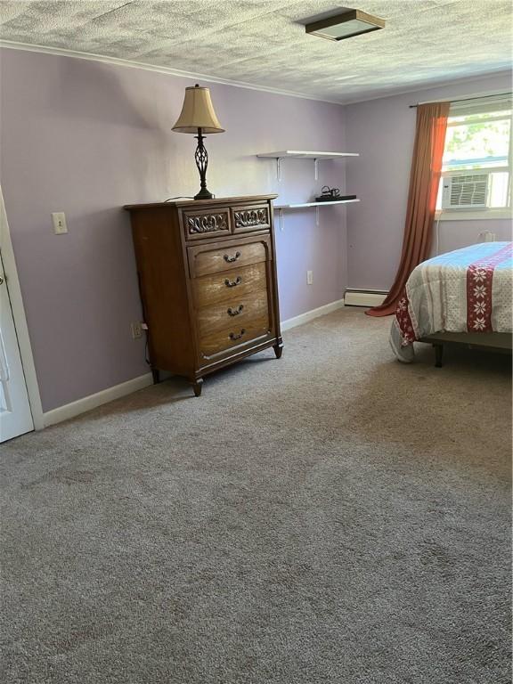 79 Dewey St, Woonsocket, RI 02895 - bedroom with a textured ceiling, baseboard heating, cooling unit, baseboards, and crown molding