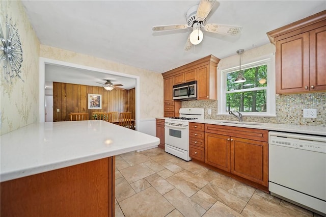 10 Meadowland Dr, North Kingstown, RI 02852 - kitchen featuring white appliances, a sink, a ceiling fan, backsplash, and wallpapered walls