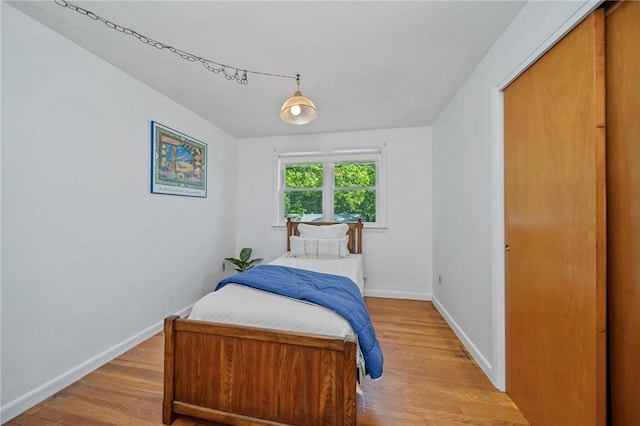10 Meadowland Dr, North Kingstown, RI 02852 - bedroom with light wood-type flooring and baseboards