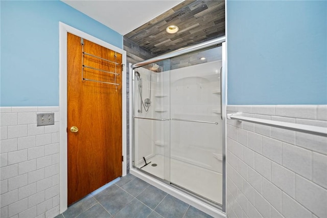 10 Meadowland Dr, North Kingstown, RI 02852 - full bathroom with tile walls, a stall shower, tile patterned flooring, and a wainscoted wall