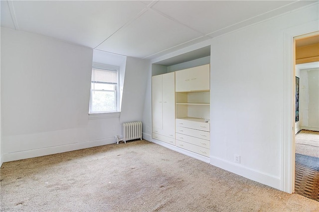 222 Second St, East Providence, RI 02865 - unfurnished bedroom featuring radiator, light colored carpet, and baseboards