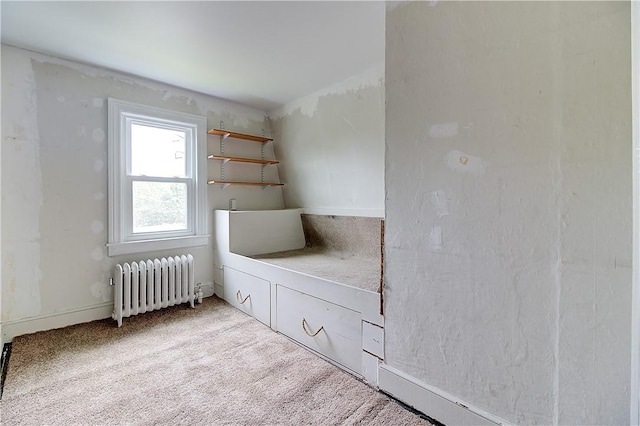 222 Second St, East Providence, RI 02865 - unfurnished bedroom with radiator heating unit and carpet