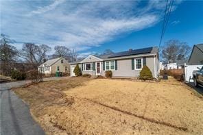 33 Merle St, Warwick, RI 02889 - view of front facade featuring roof mounted solar panels
