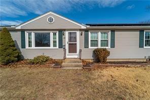 33 Merle St, Warwick, RI 02889 - view of front of house with roof mounted solar panels