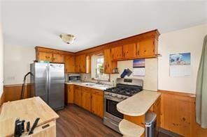 33 Merle St, Warwick, RI 02889 - kitchen featuring appliances with stainless steel finishes, brown cabinets, and light countertops