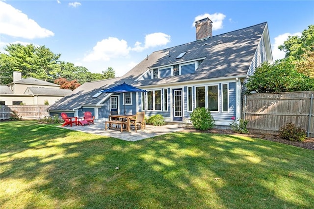 7 Massasoit Ave, Pawtucket, RI 02861 - back of property with a patio, a chimney, and entry steps