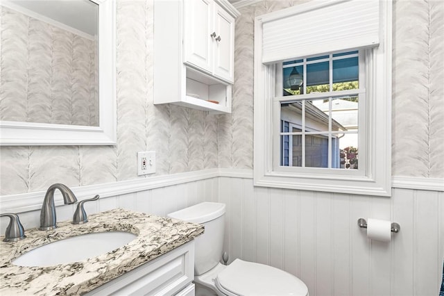 7 Massasoit Ave, Pawtucket, RI 02861 - bathroom with vanity, toilet, wainscoting, and wallpapered walls