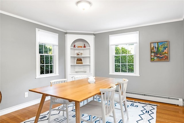 7 Massasoit Ave, Pawtucket, RI 02861 - dining room with light wood finished floors, crown molding, a baseboard heating unit, and baseboards