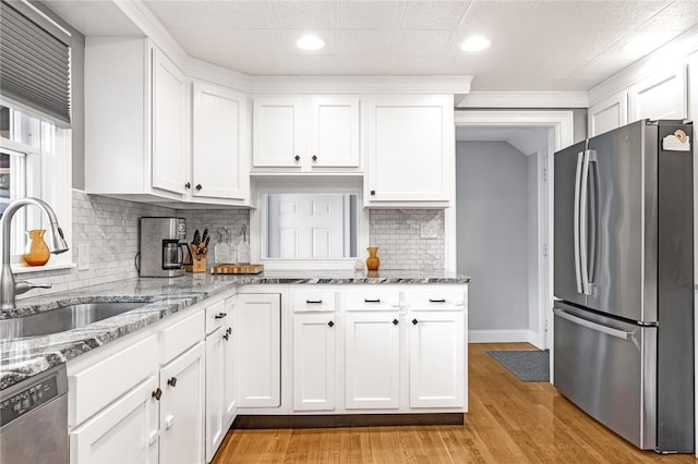 7 Massasoit Ave, Pawtucket, RI 02861 - kitchen featuring appliances with stainless steel finishes, a sink, white cabinetry, and recessed lighting