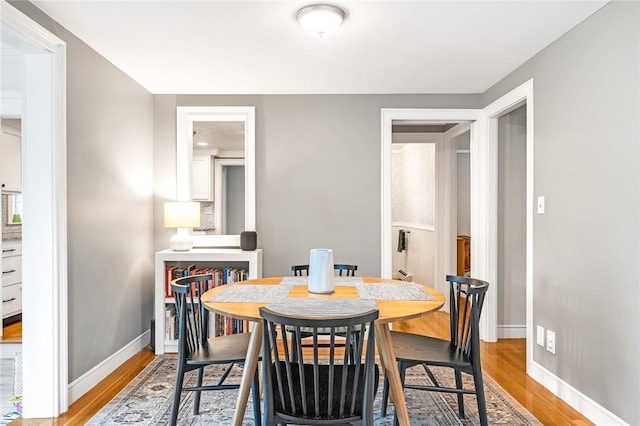 7 Massasoit Ave, Pawtucket, RI 02861 - dining area featuring light wood-style flooring and baseboards