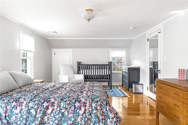 7 Massasoit Ave, Pawtucket, RI 02861 - bedroom featuring light wood-type flooring, ornamental molding, and multiple windows