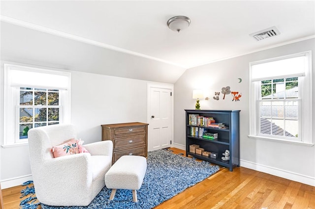 7 Massasoit Ave, Pawtucket, RI 02861 - living area with baseboards, light wood finished floors, and vaulted ceiling