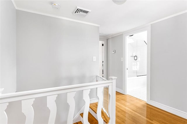 7 Massasoit Ave, Pawtucket, RI 02861 - corridor featuring light wood-style floors, an upstairs landing, ornamental molding, and baseboards