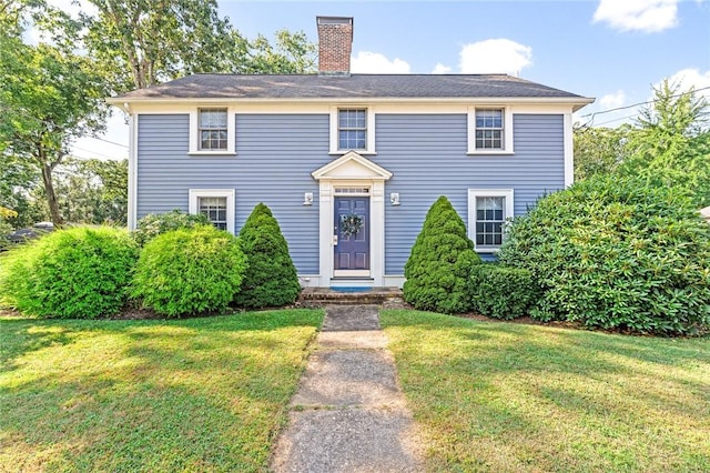 7 Massasoit Ave, Pawtucket, RI 02861 - colonial house featuring a front lawn and a chimney