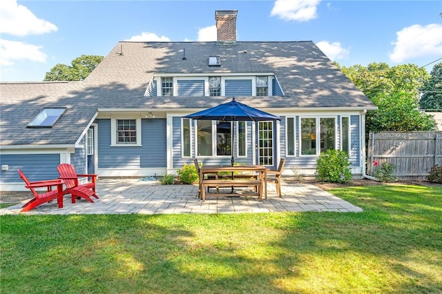 7 Massasoit Ave, Pawtucket, RI 02861 - rear view of house with a chimney and a patio area