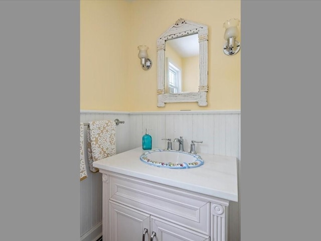 bathroom featuring wainscoting and vanity