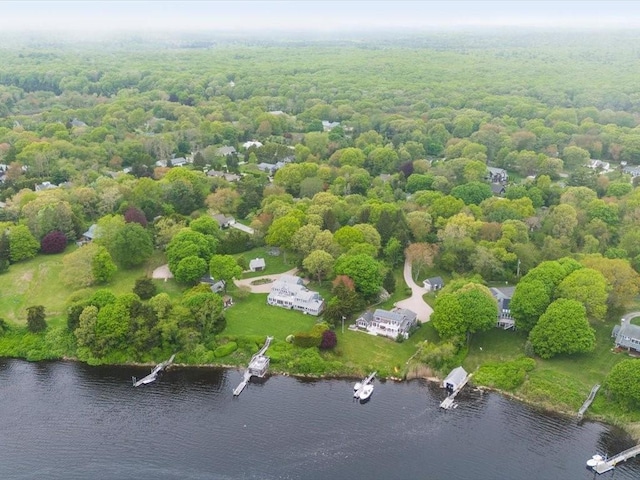 aerial view of a nearby body of water and a heavily wooded area