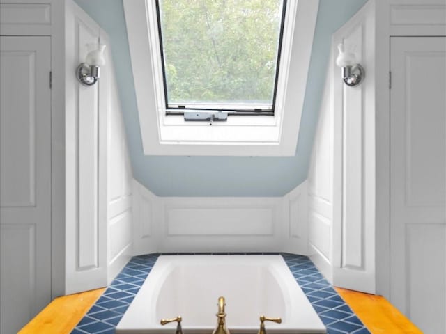 bathroom with a tub