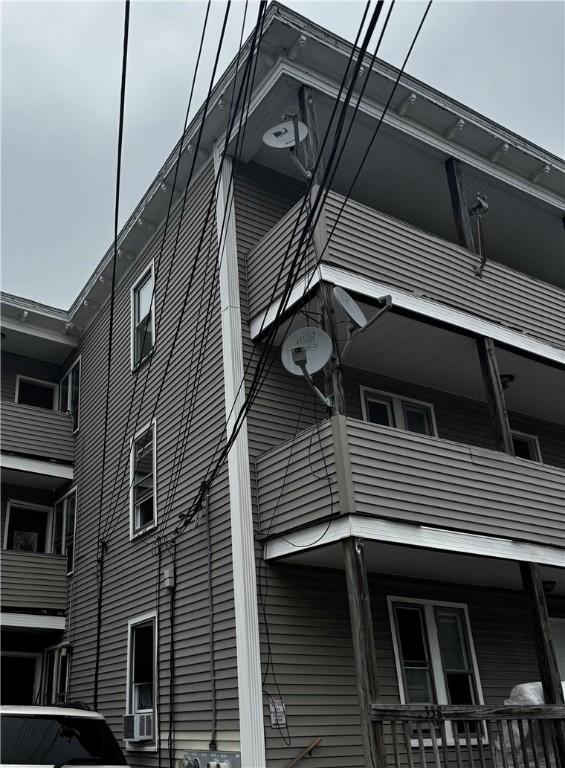 342 Paradis Ave, Woonsocket, RI 02895 - view of side of property with a balcony and cooling unit