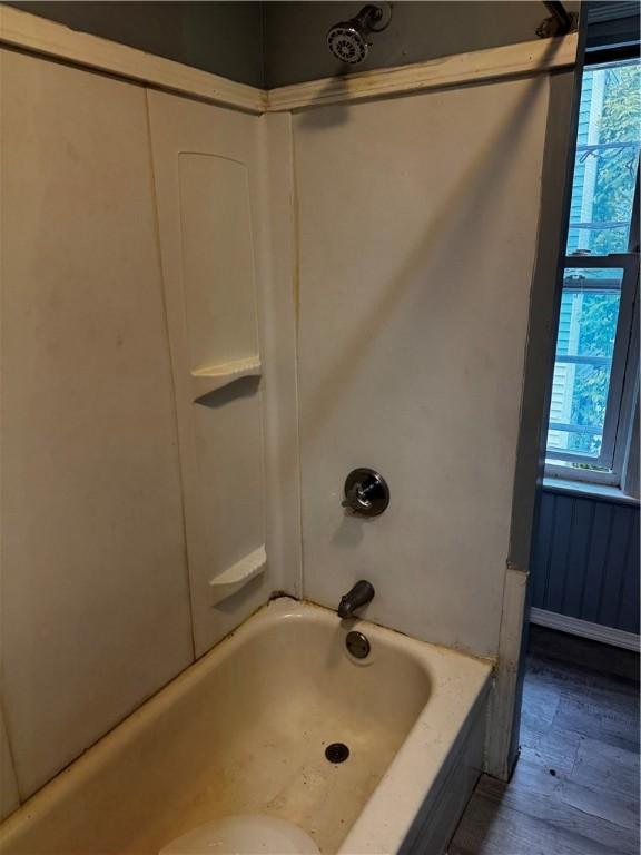 342 Paradis Ave, Woonsocket, RI 02895 - bathroom with plenty of natural light, wood finished floors, and tub / shower combination