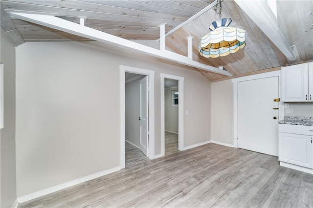 46 E Andrew Comstock Rd, Warwick, RI 02886 - unfurnished living room with light wood finished floors, baseboards, and wood ceiling