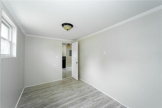 46 E Andrew Comstock Rd, Warwick, RI 02886 - spare room featuring light wood-style flooring, crown molding, and baseboards