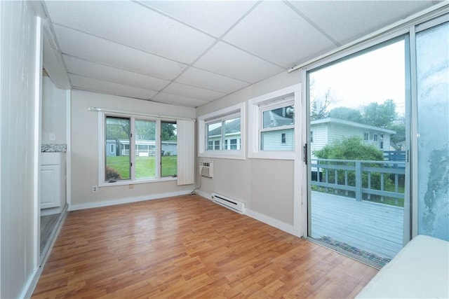 46 E Andrew Comstock Rd, Warwick, RI 02886 - unfurnished sunroom featuring a baseboard heating unit and a wall mounted air conditioner