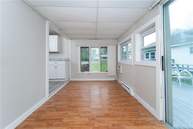 46 E Andrew Comstock Rd, Warwick, RI 02886 - unfurnished sunroom featuring a baseboard heating unit and a wall mounted AC