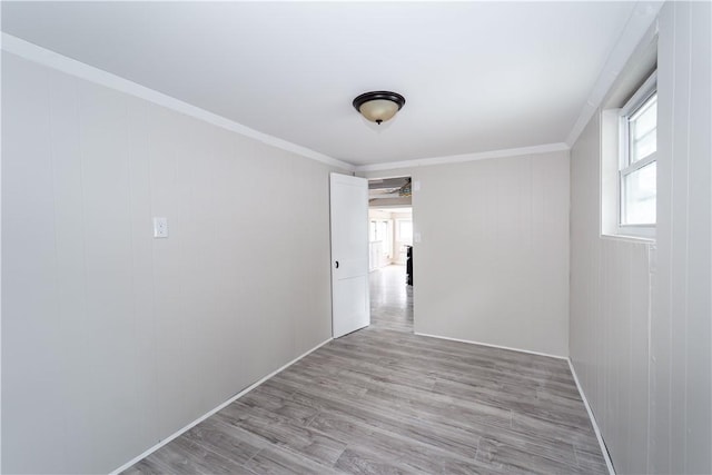 46 E Andrew Comstock Rd, Warwick, RI 02886 - empty room with light wood-type flooring and ornamental molding
