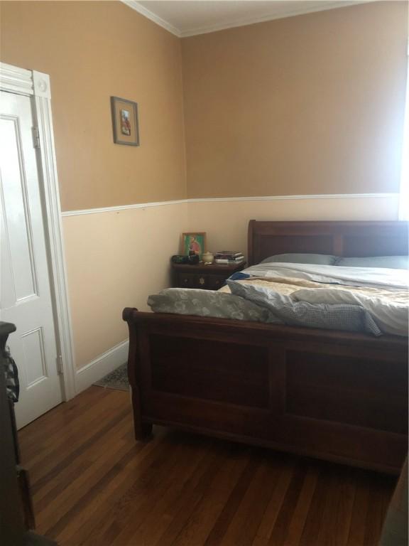 149 Peace St, Providence, RI 05290 - bedroom featuring ornamental molding, dark wood finished floors, and baseboards