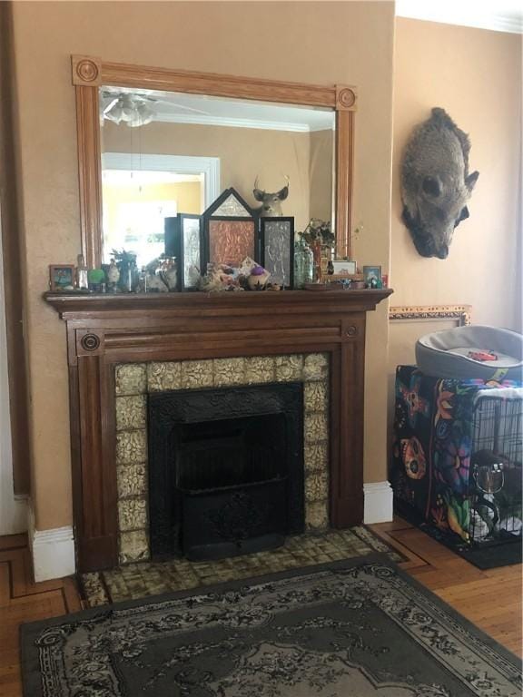 149 Peace St, Providence, RI 05290 - detailed view of a tile fireplace, crown molding, and wood finished floors