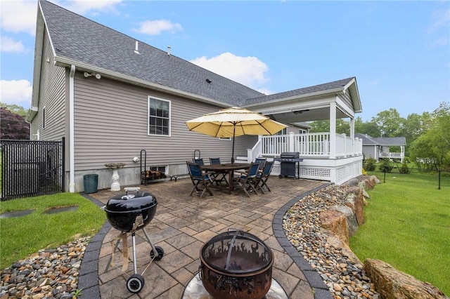 1351 Pippin Orchard Rd, Cranston, RI 02921 - back of house with a fire pit, a shingled roof, a patio, and a wooden deck