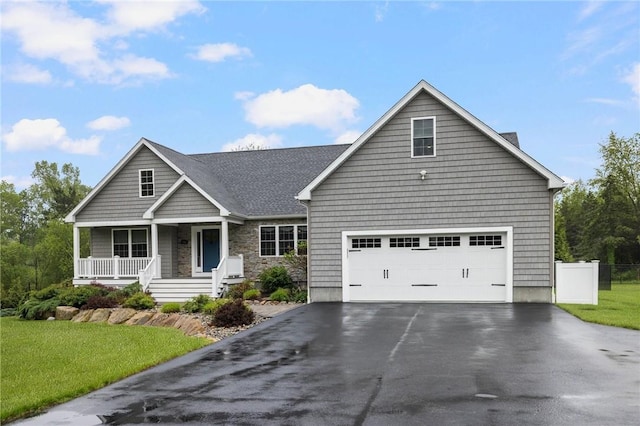 1351 Pippin Orchard Rd, Cranston, RI 02921 - view of front of house with asphalt driveway, covered porch, and a garage