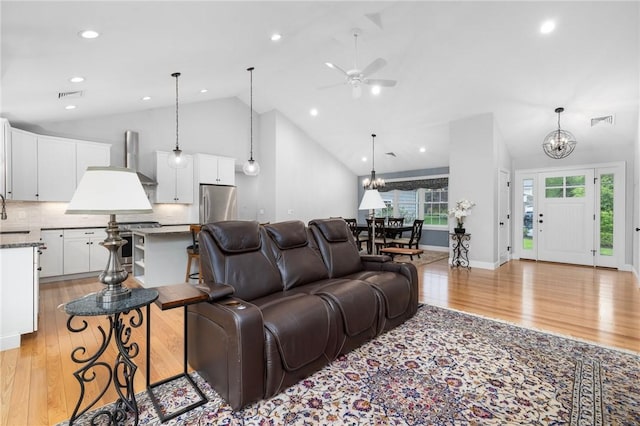 1351 Pippin Orchard Rd, Cranston, RI 02921 - living room with a chandelier, light wood finished floors, ceiling fan, recessed lighting, and high vaulted ceiling