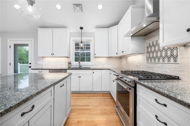1351 Pippin Orchard Rd, Cranston, RI 02921 - kitchen featuring stainless steel appliances, wall chimney exhaust hood, a sink, white cabinetry, and recessed lighting