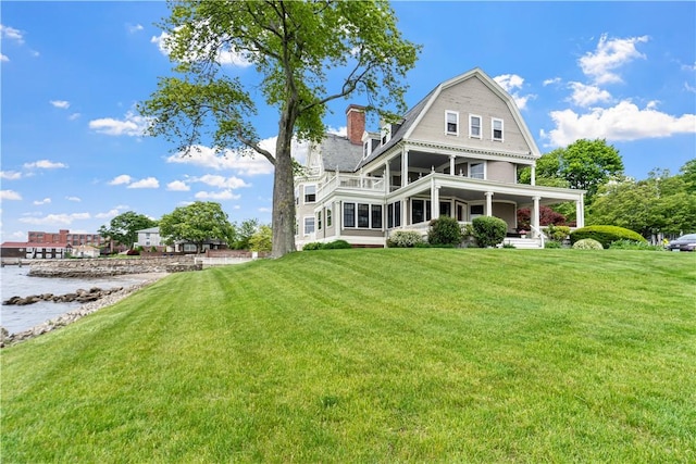 217 Hope St Unit 3, Bristol, RI 02809 - back of house featuring a porch, a yard, and a water view