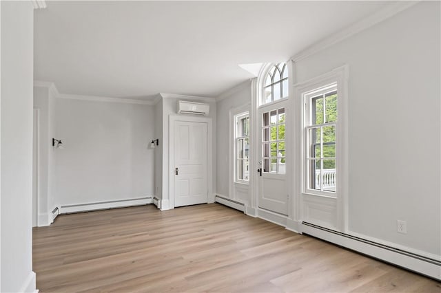 217 Hope St Unit 3, Bristol, RI 02809 - foyer featuring a baseboard heating unit, an AC wall unit, crown molding, a baseboard radiator, and light wood finished floors