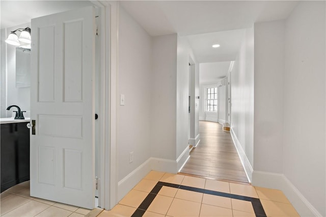 217 Hope St Unit 3, Bristol, RI 02809 - corridor featuring baseboards, light tile patterned flooring, recessed lighting, and a sink