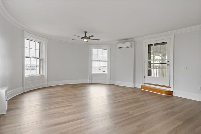 217 Hope St Unit 3, Bristol, RI 02809 - unfurnished room with a wall mounted AC, plenty of natural light, ornamental molding, a ceiling fan, and light wood finished floors