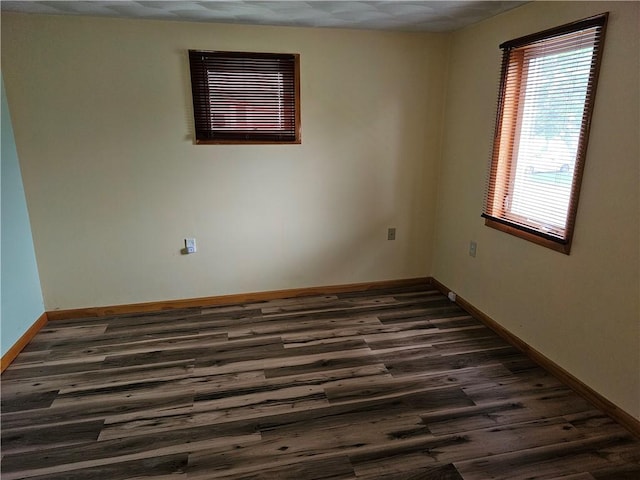 121 Friendship St, North Providence, RI 02904 - unfurnished room with dark wood-type flooring and baseboards