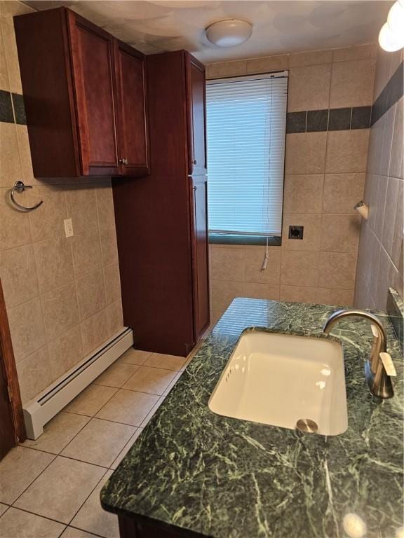 121 Friendship St, North Providence, RI 02904 - bathroom with tile walls, a baseboard heating unit, tile patterned flooring, and vanity