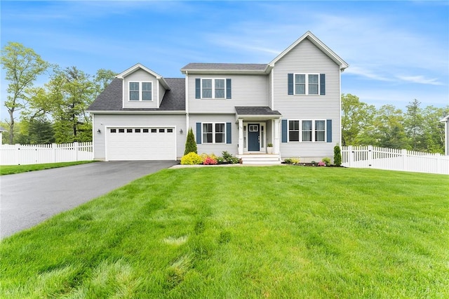 view of front of house with driveway, a garage, and a shingled roof