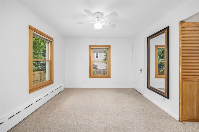 10 Curry Ave, Newport, RI 02840 - unfurnished room featuring a baseboard heating unit, light carpet, a ceiling fan, and baseboards